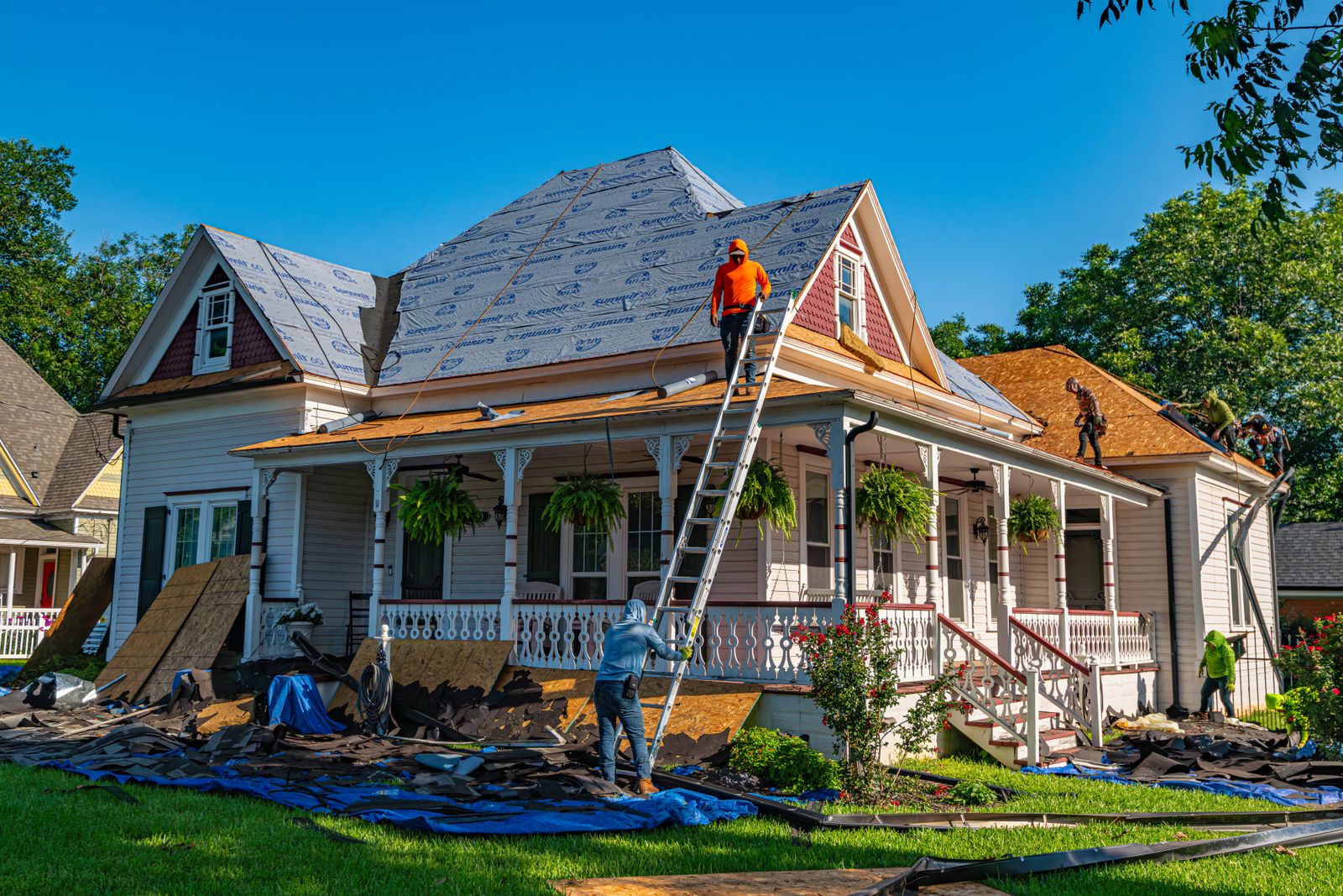 Crew replacing the roof of a historic Texas home