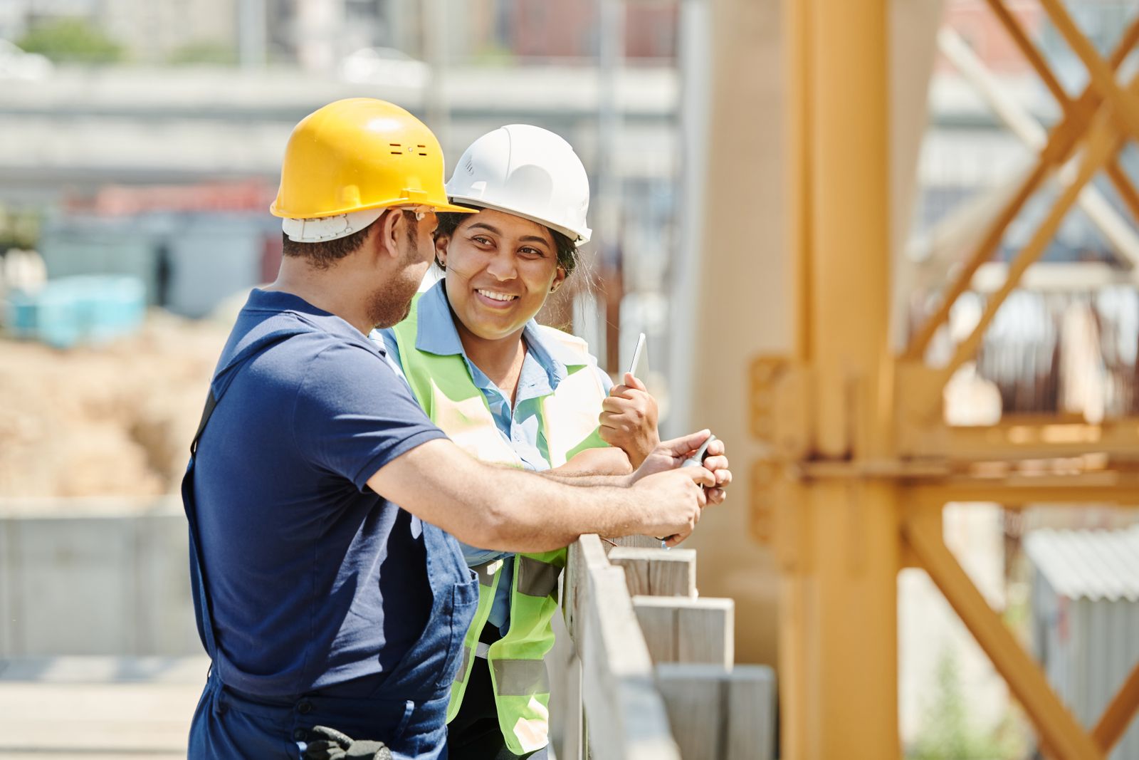Project managers reviewing plans at a job site